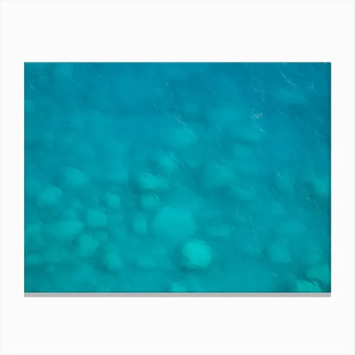 Rocks in the turquoise sea Canvas Print by Marika Huisman